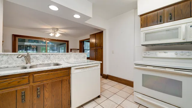 a kitchen with a refrigerator and a sink
