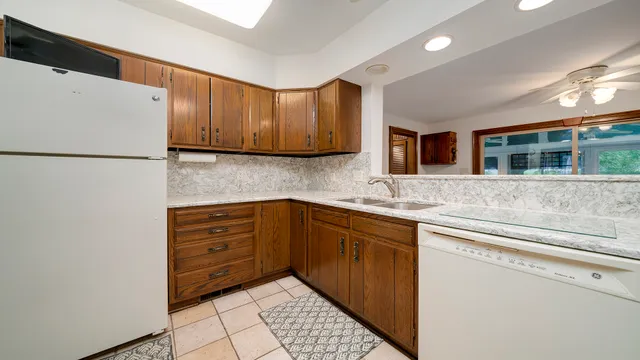 a view of a dining room with furniture wooden floor and a chandelier
