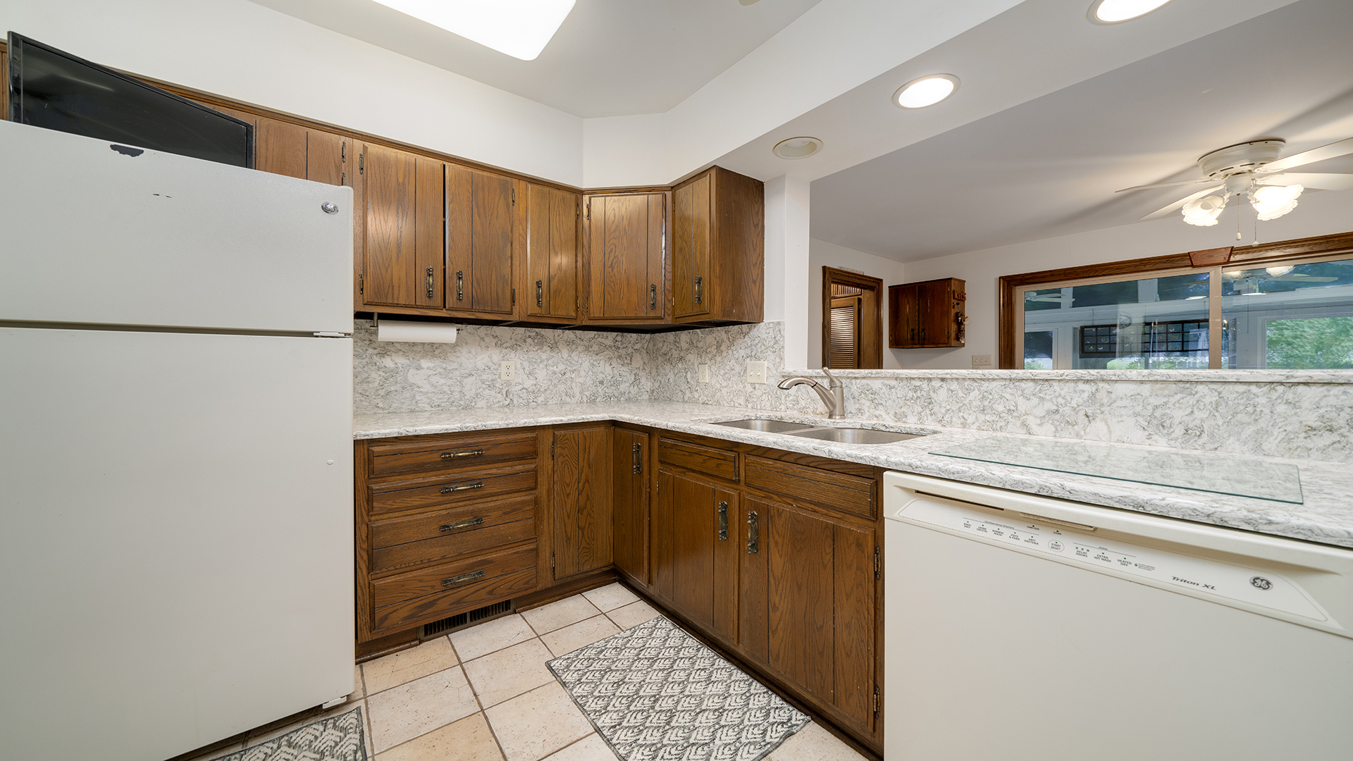 321 East Chamberlin Street Dixon, IL 61021 - Photo 16 of 58 a kitchen with a refrigerator and a sink