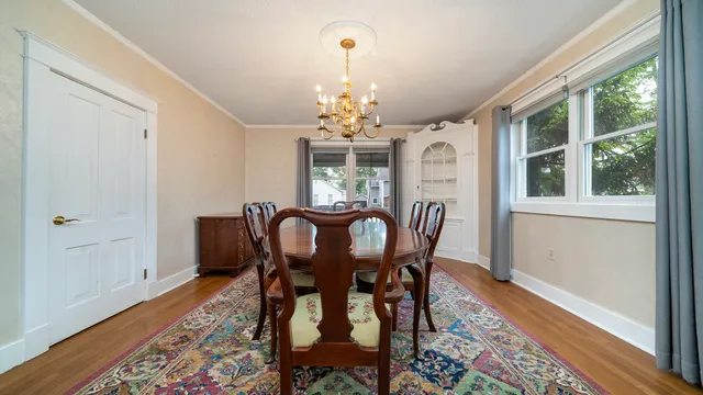 a view of a dining room with furniture window and outside view