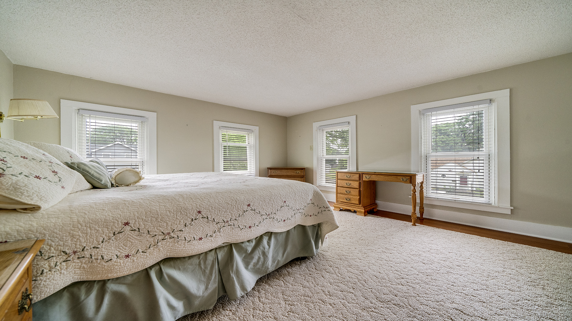 321 East Chamberlin Street Dixon, IL 61021 - Photo 33 of 58 a spacious bedroom with a bed table chair and two windows