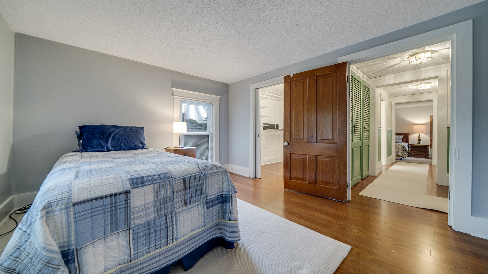 321 East Chamberlin Street Dixon, IL 61021 - Photo 36 of 58 a bedroom with a large bed and wooden floor