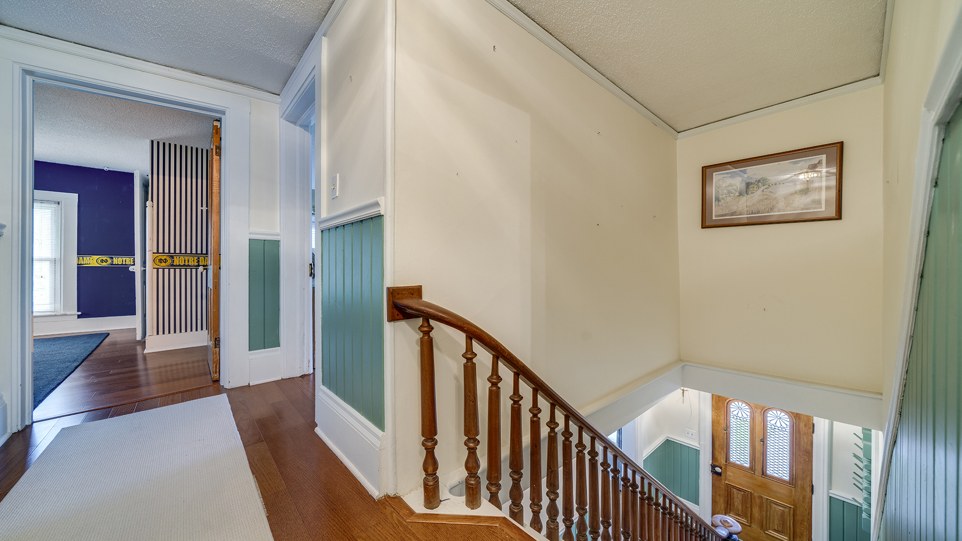 321 East Chamberlin Street Dixon, IL 61021 - Photo 39 of 58 a view of a hallway with wooden floor and stairs