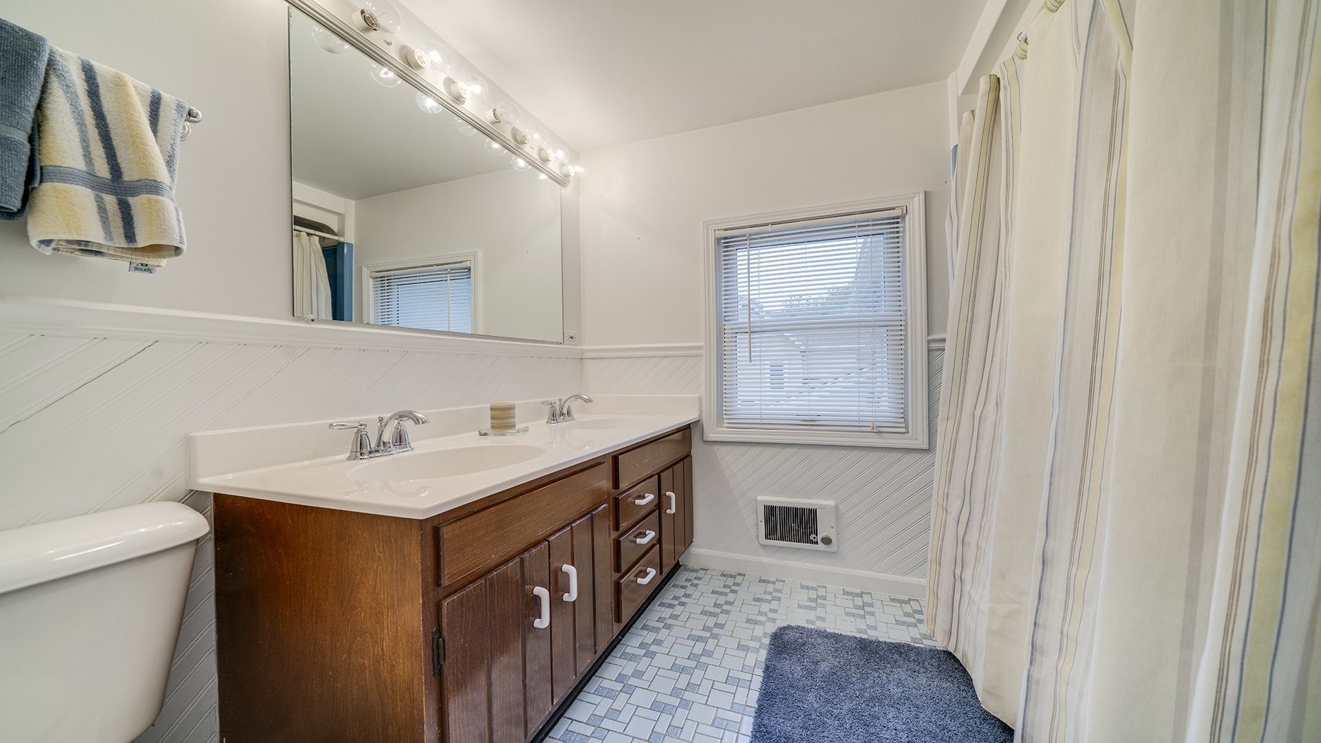 321 East Chamberlin Street Dixon, IL 61021 - Photo 40 of 58 a bathroom with a sink a toilet and a mirror