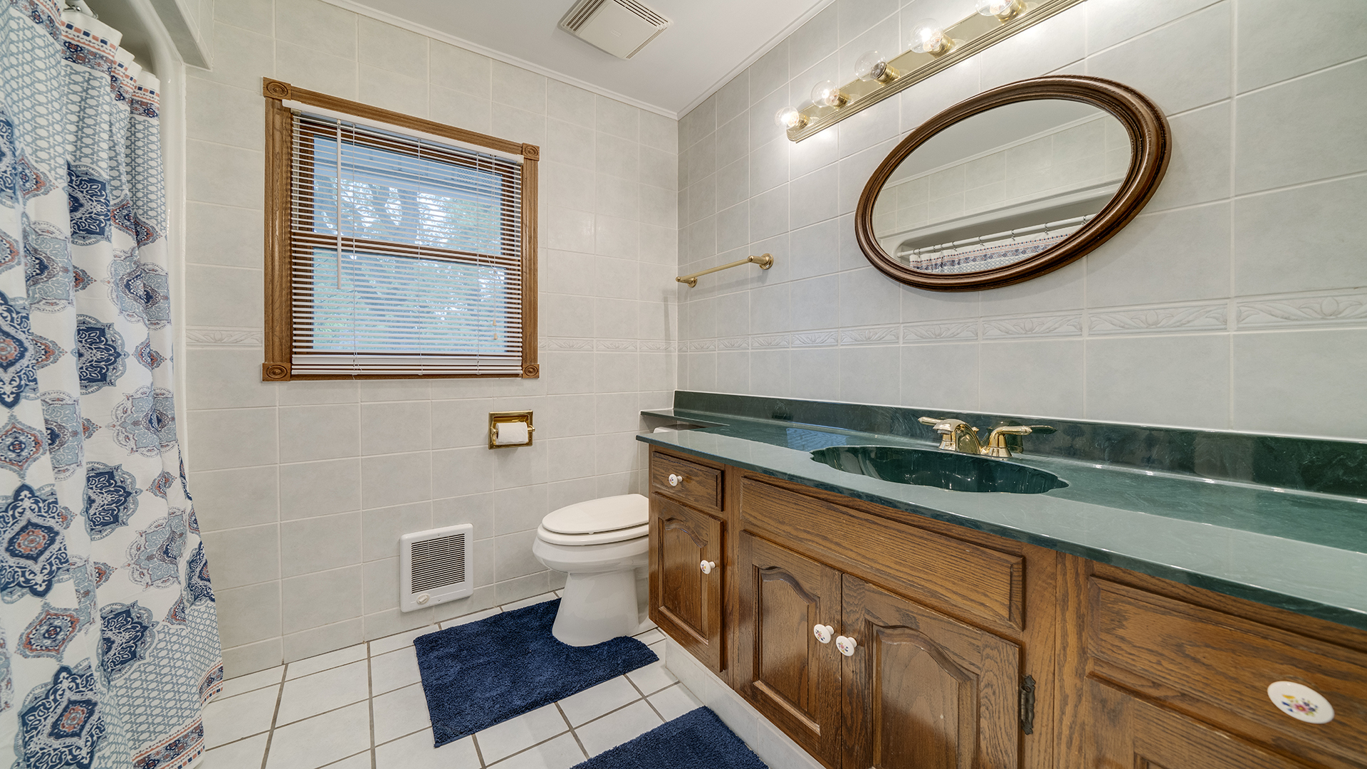 321 East Chamberlin Street Dixon, IL 61021 - Photo 41 of 58 a bathroom with a toilet a sink and mirror