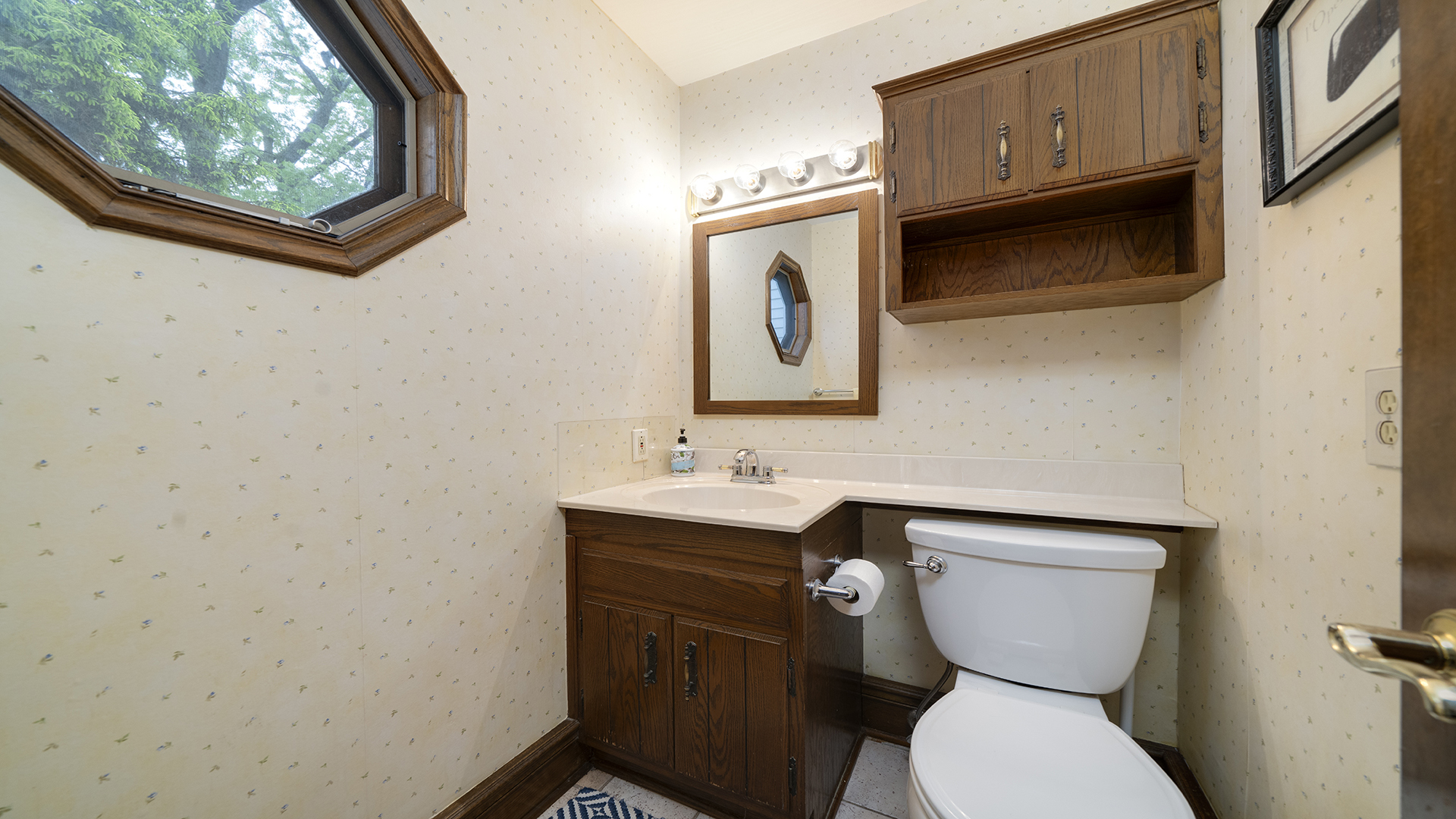 321 East Chamberlin Street Dixon, IL 61021 - Photo 43 of 58 a bathroom with a toilet sink and mirror