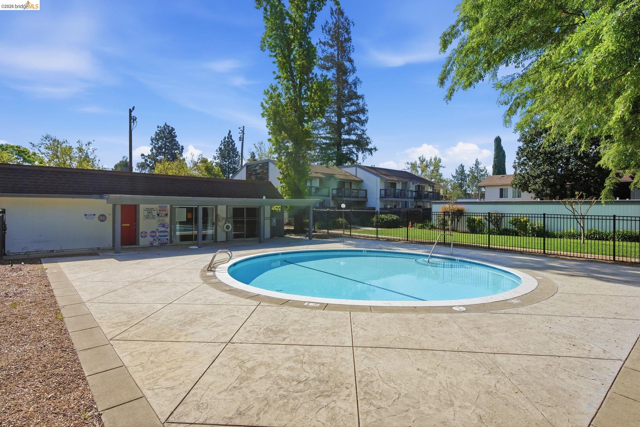 4081 Clayton Road, Unit 118 Concord, CA 94521 - Photo 26 of 30 a view of a swimming pool with a patio