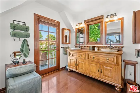a spacious bathroom with a double vanity sink and a window
