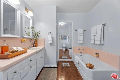 a spacious bedroom with a bed and a couch