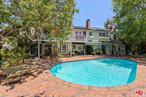 an aerial view of a house with outdoor space swimming pool and lake view