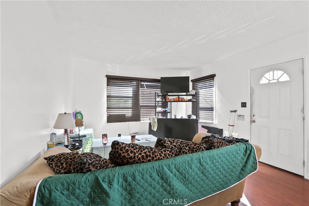 229 East Reeve Street Compton, CA 90220 - Photo 3 of 11 a living room with a couch and a table