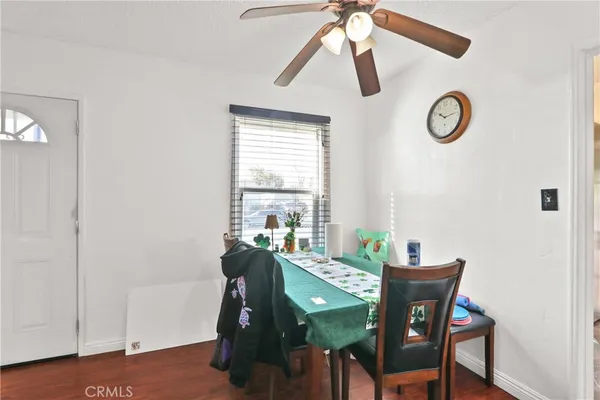 a view of a dining room with furniture and a window