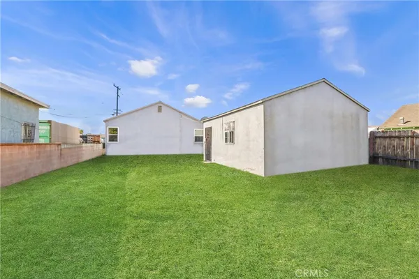 a view of a backyard with plants and a patio
