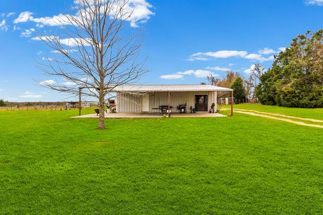 a view of a house with a big yard