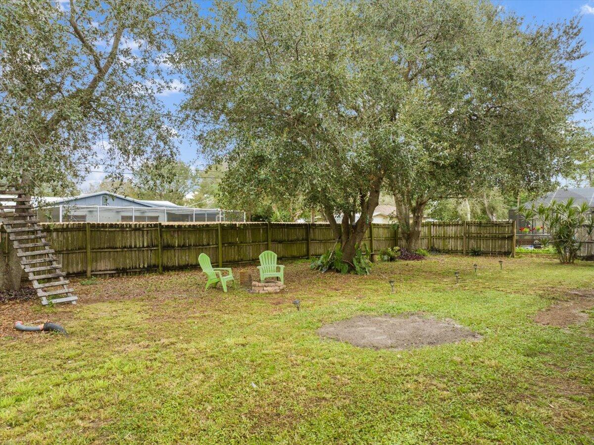 7202 Donlon Road Fort Pierce, FL 34951 - Photo 16 of 33 a view of a yard with swimming pool