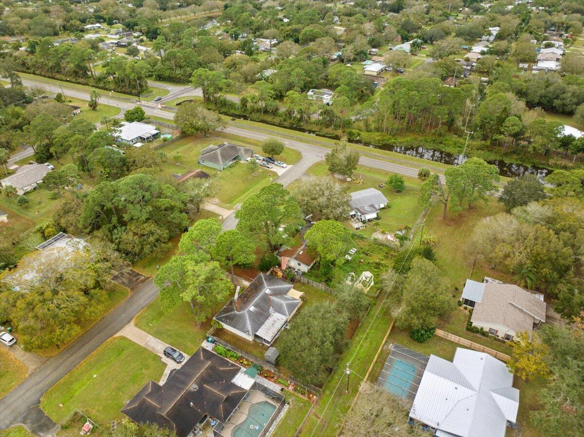 7202 Donlon Road Fort Pierce, FL 34951 - Photo 32 of 33 an aerial view of residential houses with outdoor space