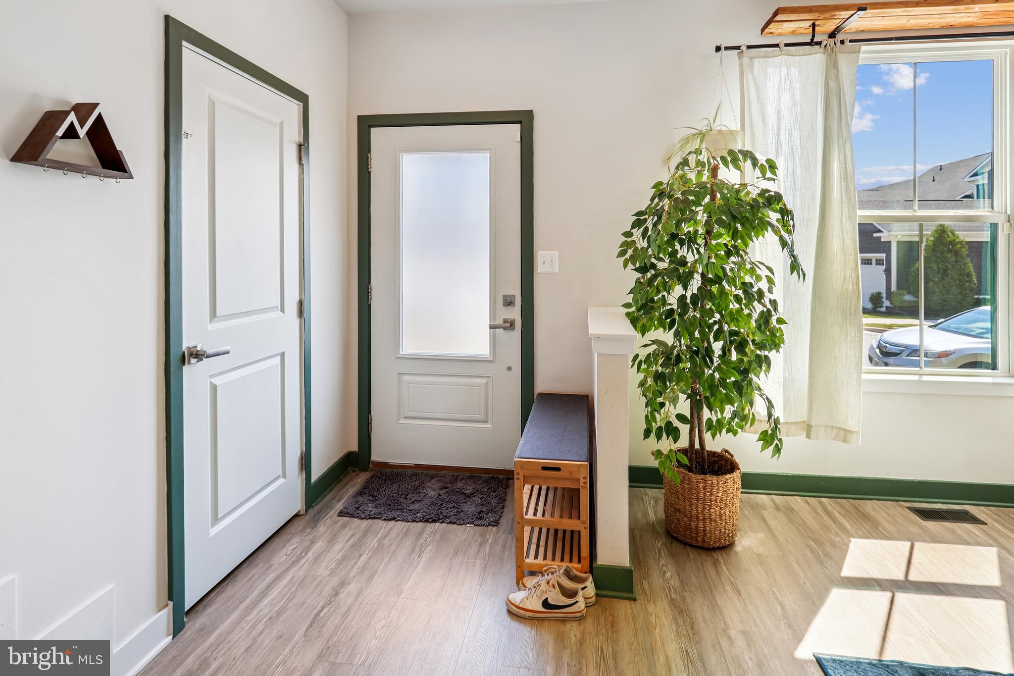 6412 Dalston Street Middle River, MD 21220 - Photo 11 of 53 a view of a entryway with wooden floor and a potted plant