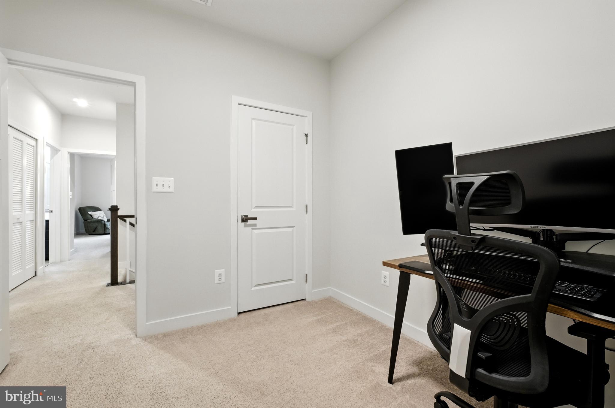 6412 Dalston Street Middle River, MD 21220 - Photo 42 of 53 a view of a workspace with furniture and gym equipment