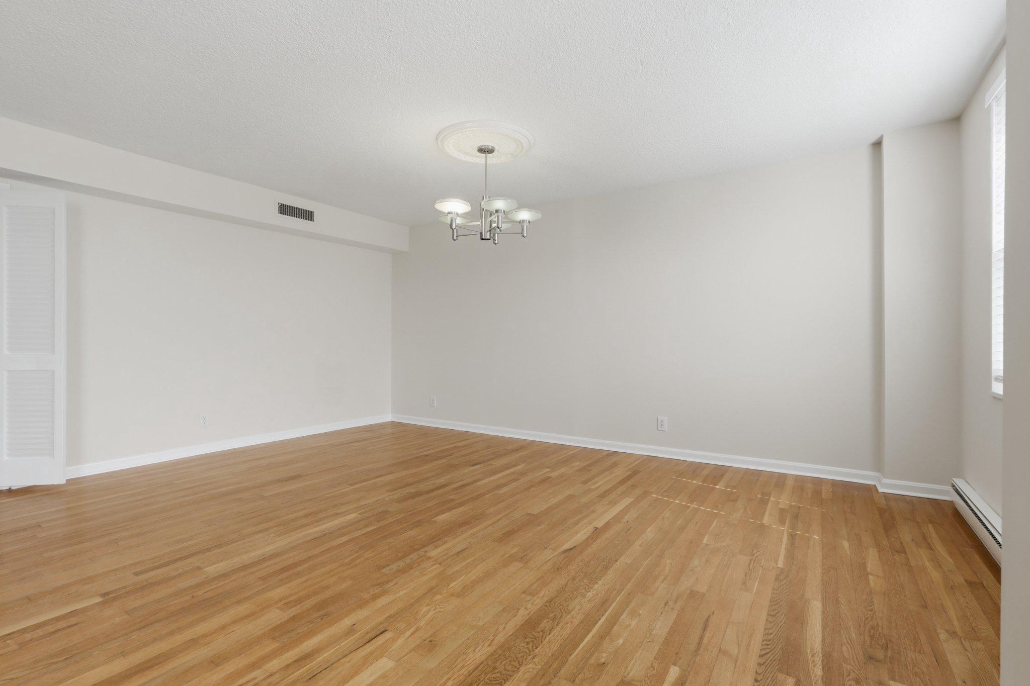 1101 St Paul Street, Unit 1212 Baltimore, MD 21202 - Photo 17 of 36 Spacious, sunlit open living/dining area.