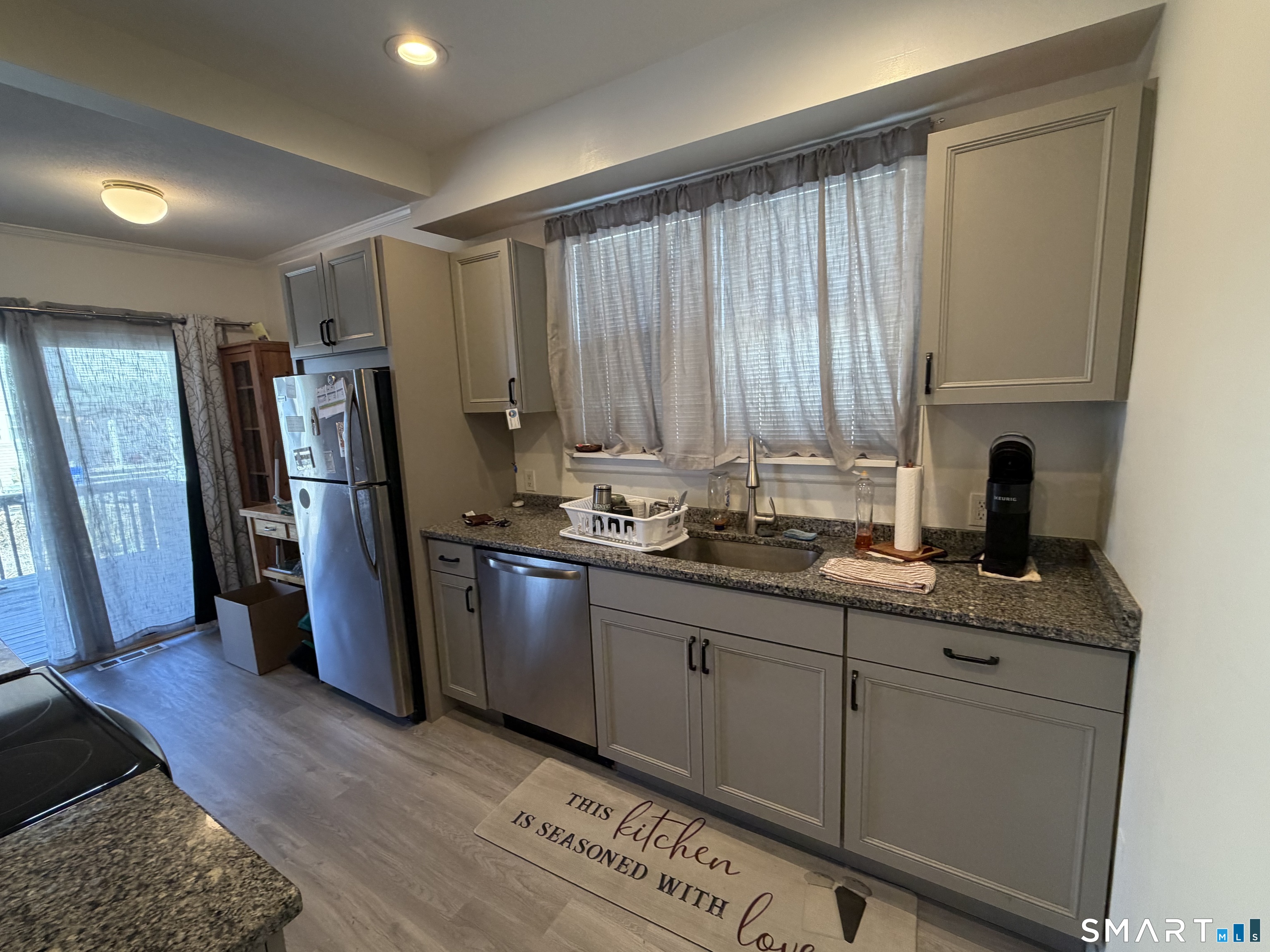 322 Clark Avenue Branford, CT 06405 - Photo 5 of 14 a kitchen with stainless steel appliances granite countertop a refrigerator and a sink
