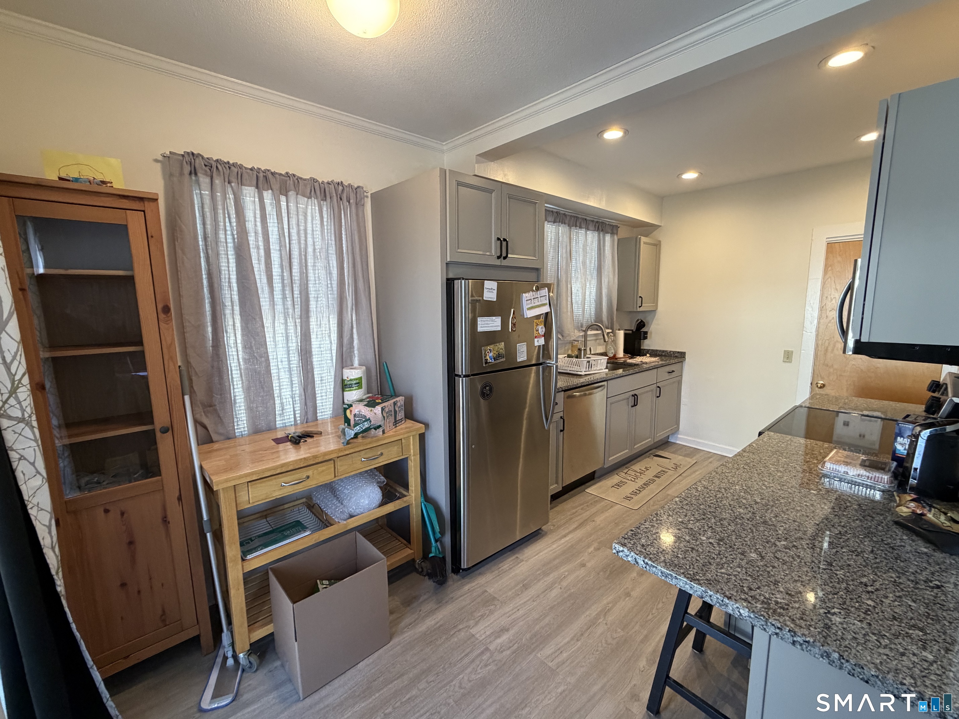 322 Clark Avenue Branford, CT 06405 - Photo 7 of 14 a kitchen with stainless steel appliances granite countertop a refrigerator stove and sink