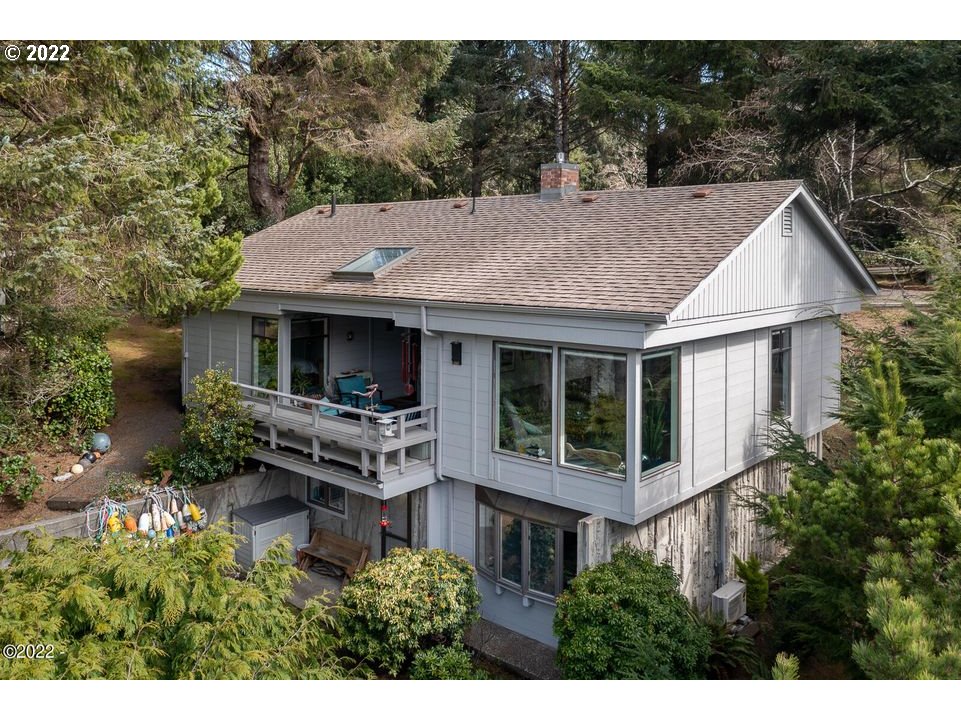 1 Ridge Crest Road Gleneden Beach, OR 97388 - Photo 1 of 32 a aerial view of a house with a yard balcony and seating space