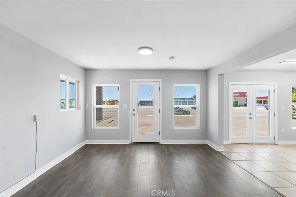 a view of an empty room and a window