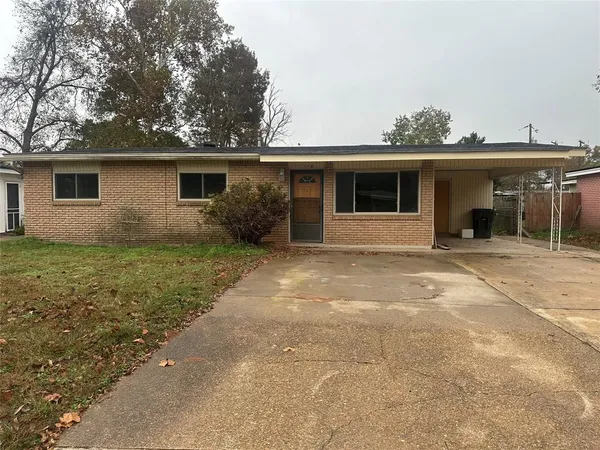 a house with trees in the background