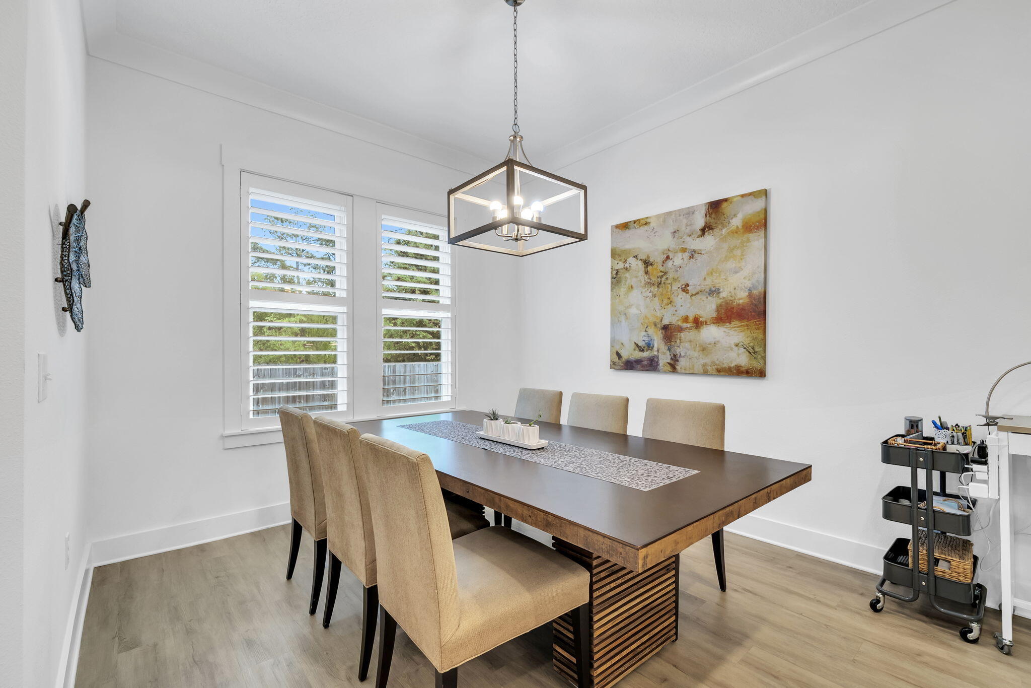 1166 Deer Moss Loop Niceville, FL 32578 - Photo 21 of 46 a view of a dining room with furniture window and wooden floor