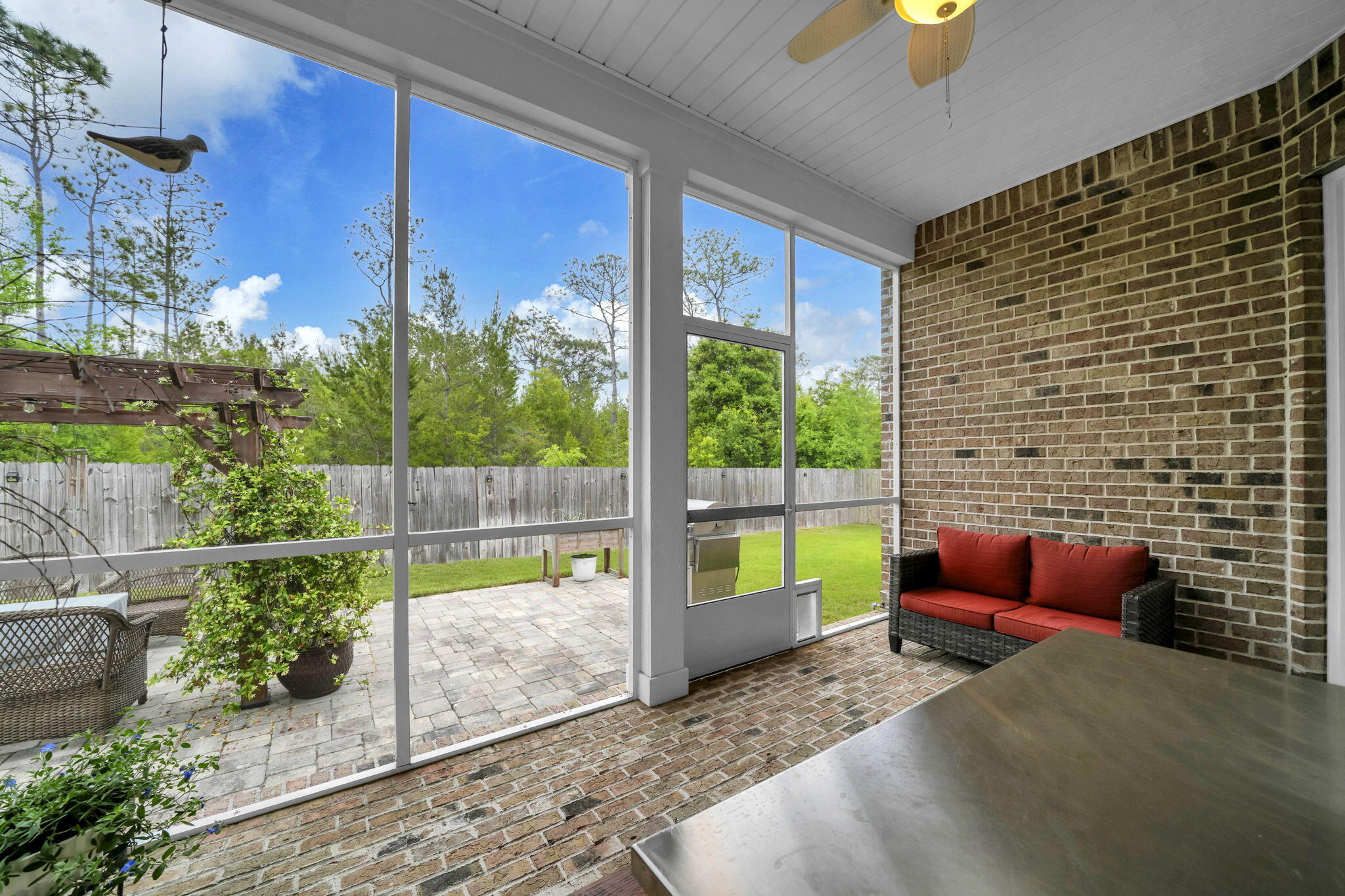 1166 Deer Moss Loop Niceville, FL 32578 - Photo 41 of 46 a backyard of a house with seating space