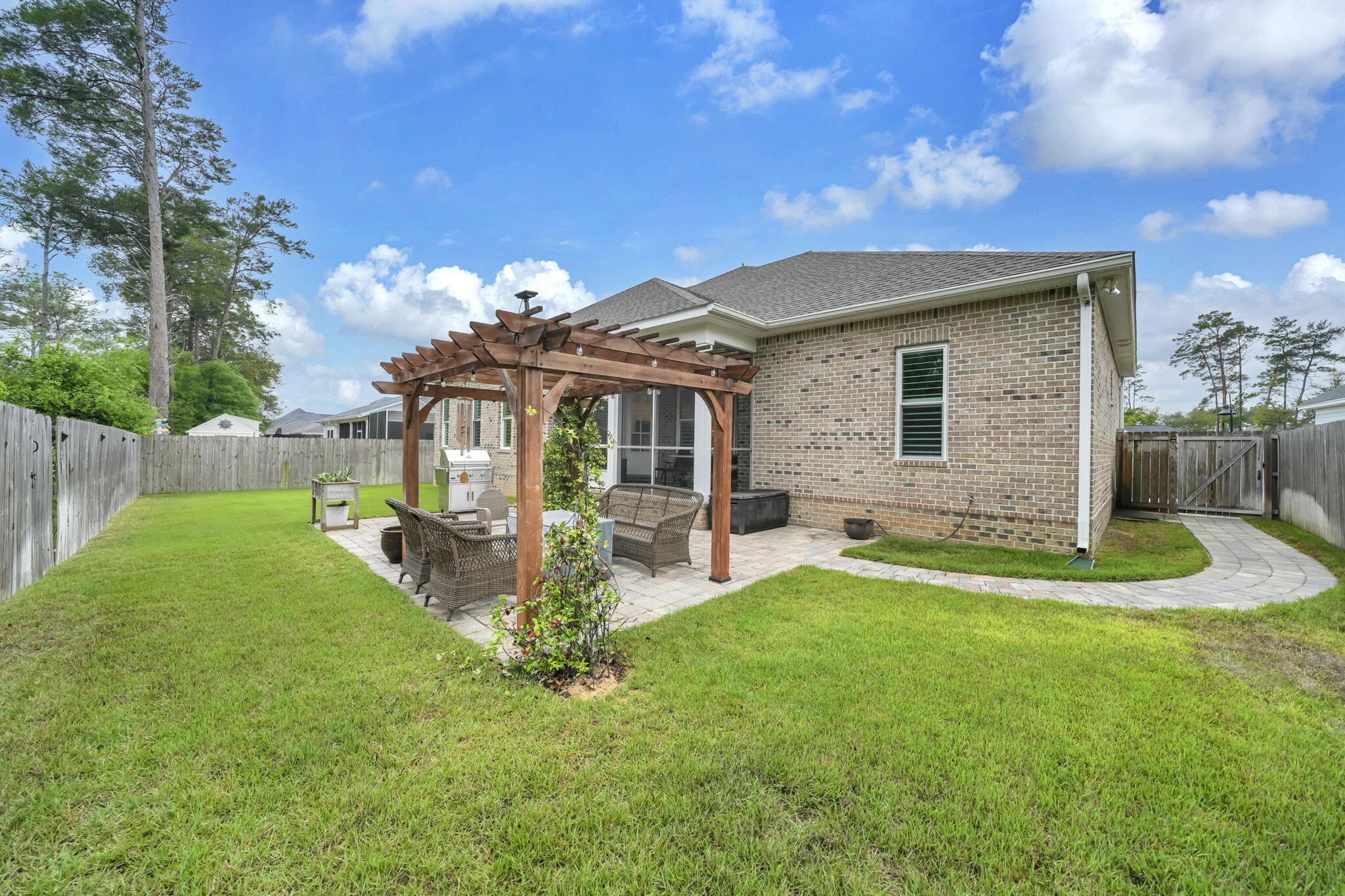 1166 Deer Moss Loop Niceville, FL 32578 - Photo 43 of 46 Brick paved patio with pergola