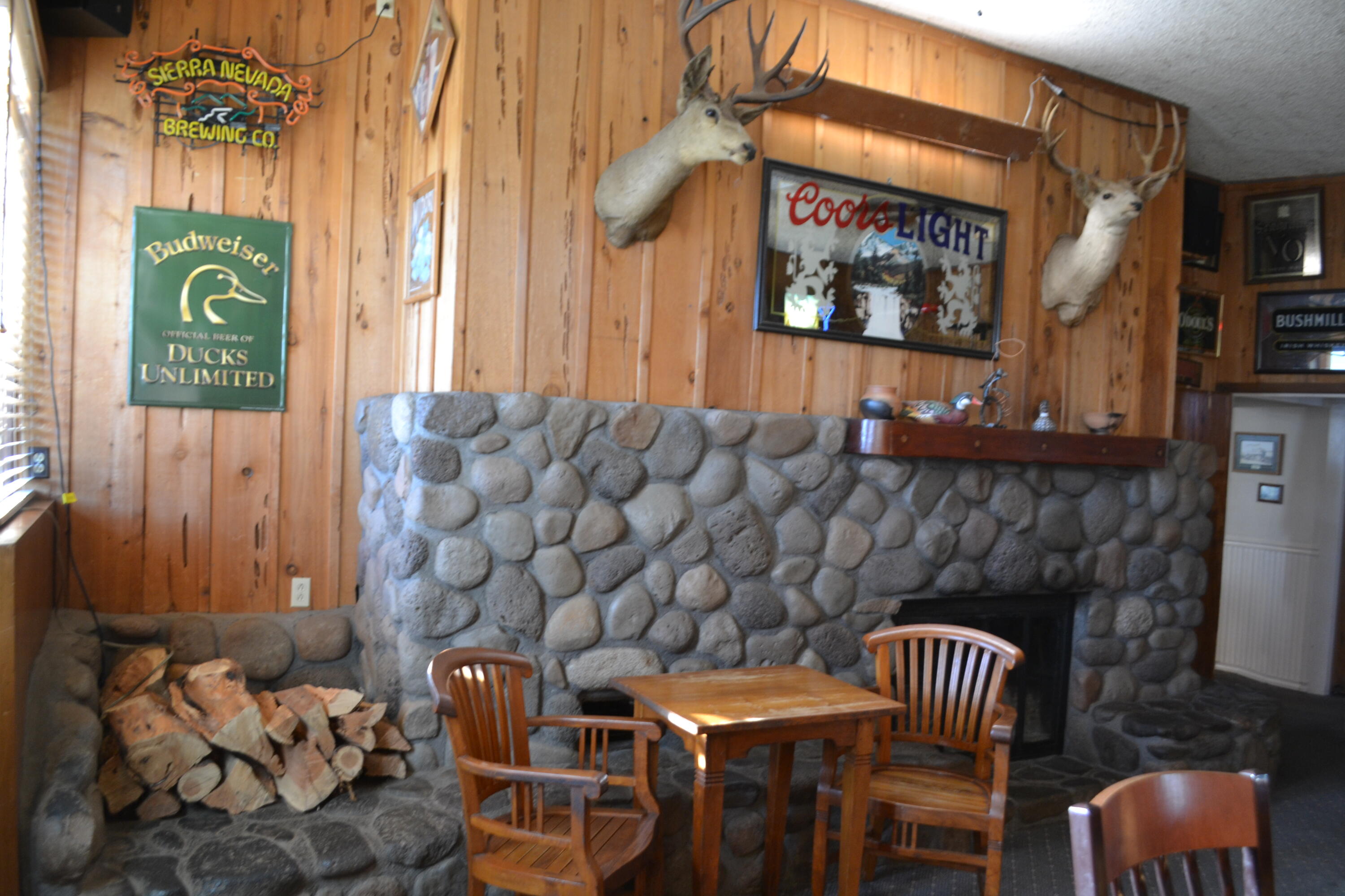 24860 Main Street Fall River Mills, CA 96028 - Photo 20 of 50 a couple of chairs sitting in front of a building