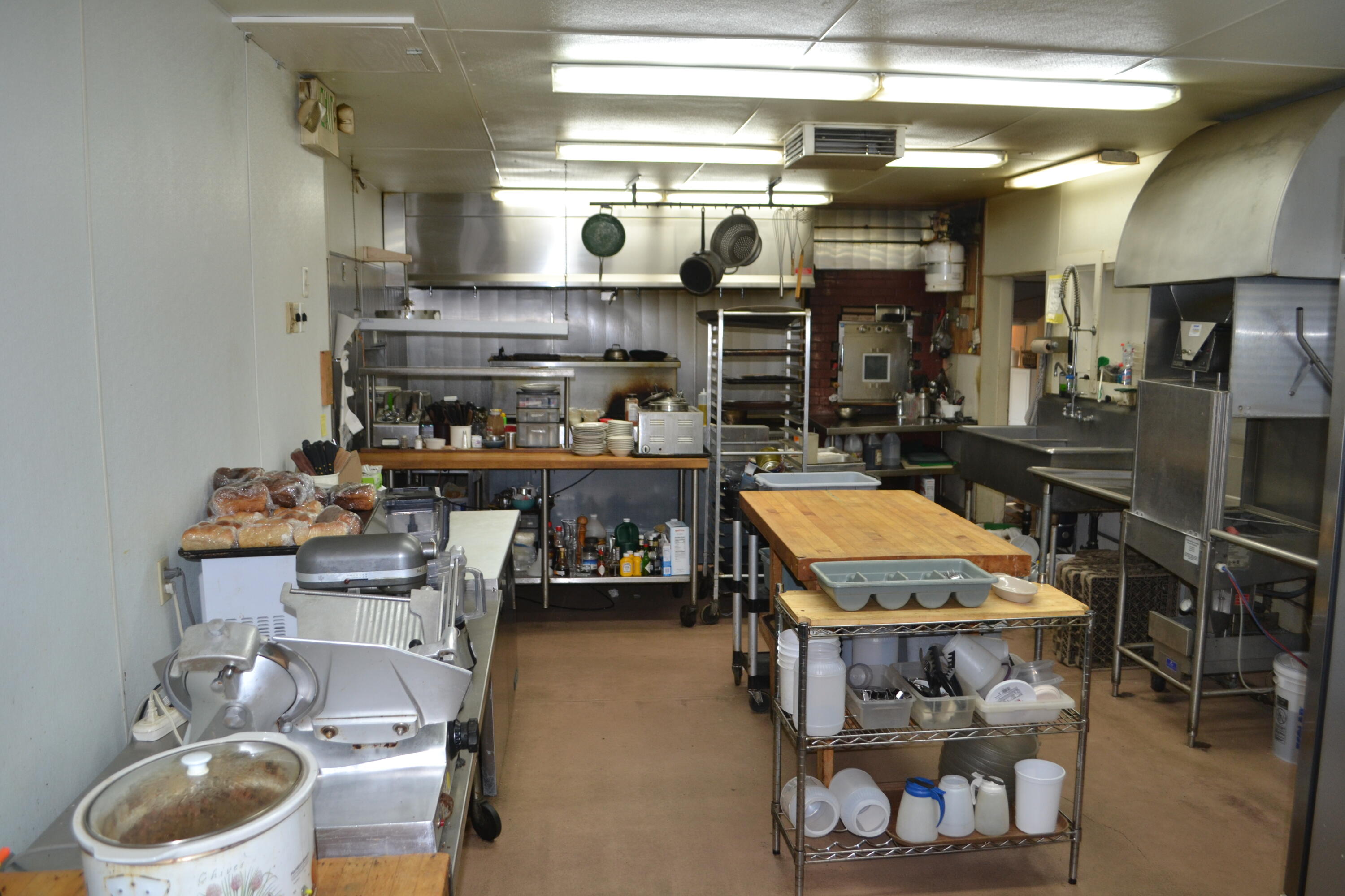 24860 Main Street Fall River Mills, CA 96028 - Photo 26 of 50 a room with wooden cabinets and stainless steel appliances