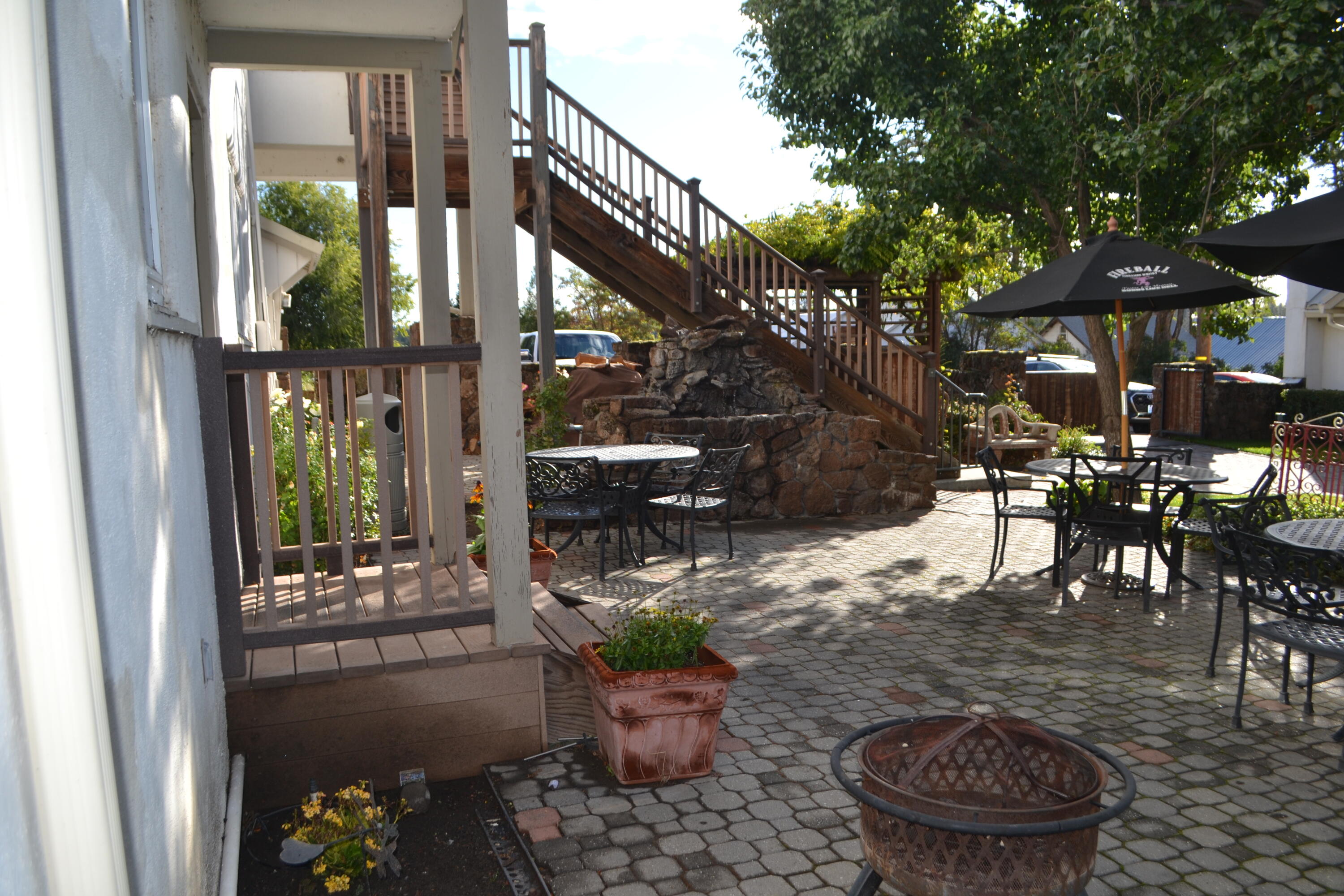 24860 Main Street Fall River Mills, CA 96028 - Photo 29 of 50 a view of a porch with chairs and potted plants