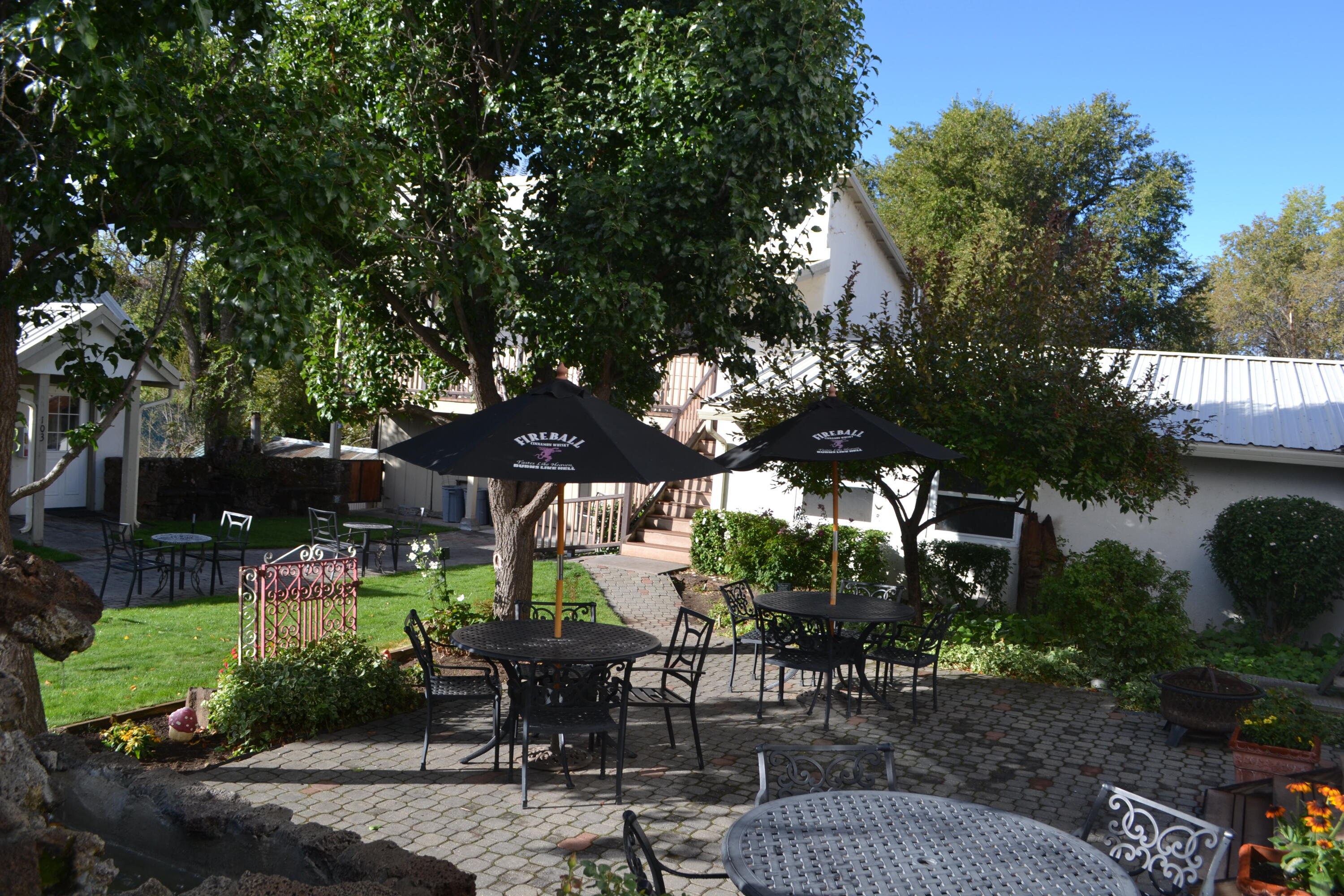 24860 Main Street Fall River Mills, CA 96028 - Photo 30 of 50 a view of patio with a table and chairs and potted plants