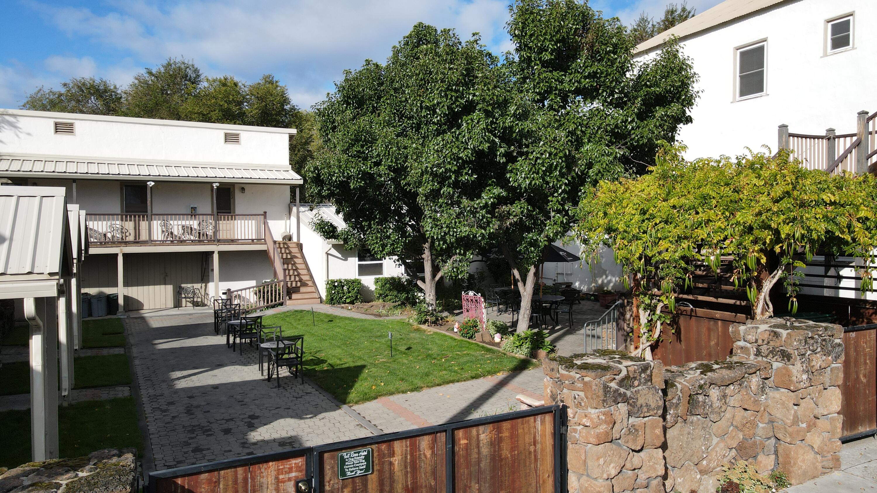 24860 Main Street Fall River Mills, CA 96028 - Photo 3 of 50 a view of a white house with a sink and yard