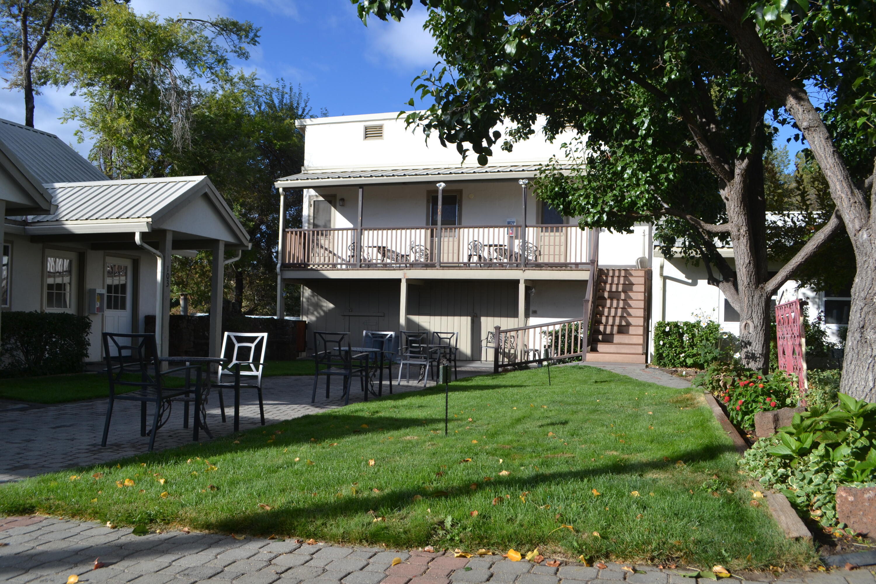 24860 Main Street Fall River Mills, CA 96028 - Photo 38 of 50 a view of a house with a yard and sitting area