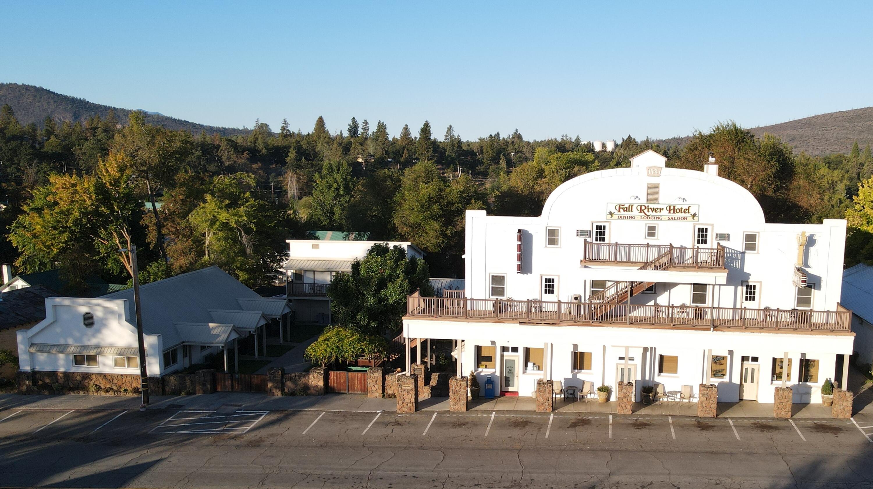 24860 Main Street Fall River Mills, CA 96028 - Photo 48 of 50 a view of a large building with a view of a city