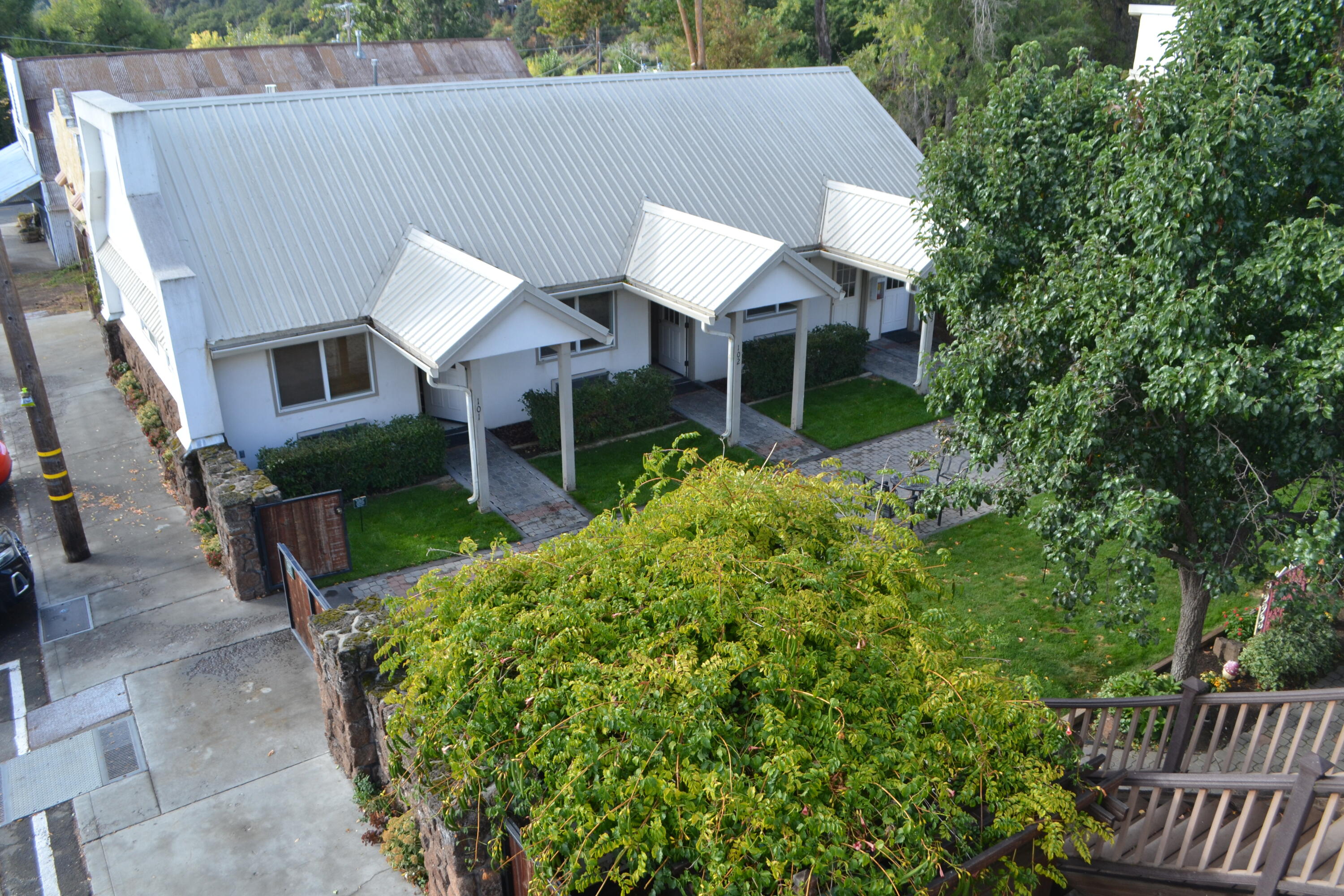 24860 Main Street Fall River Mills, CA 96028 - Photo 7 of 50 a front view of a house with garden