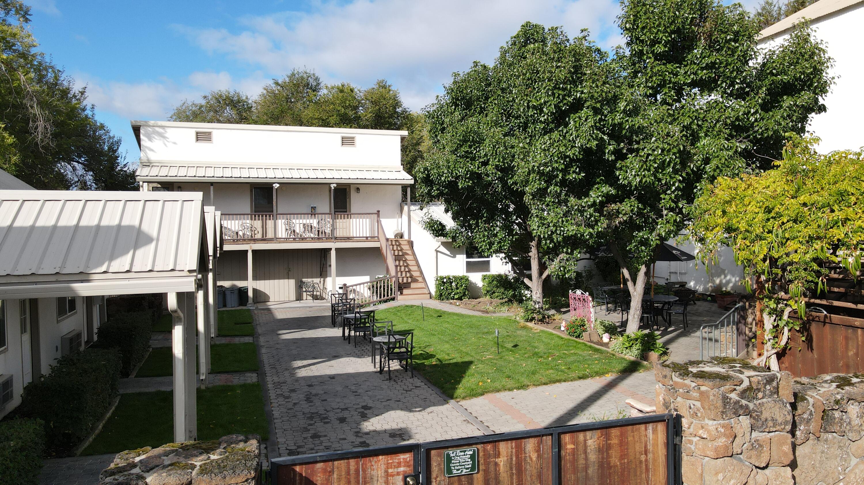 24860 Main Street Fall River Mills, CA 96028 - Photo 10 of 50 a view of a white house with a sink and yard