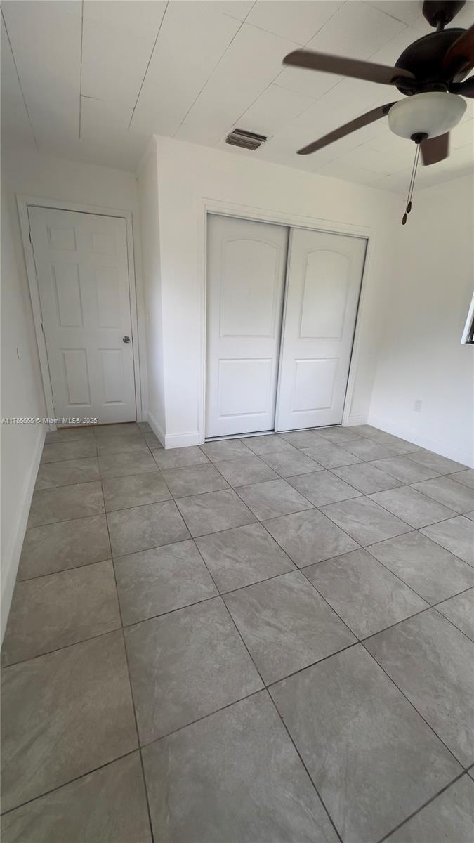 2008 North 47th Street Fort Pierce, FL 34947 - Photo 16 of 27 a view of an empty room with closet and a window