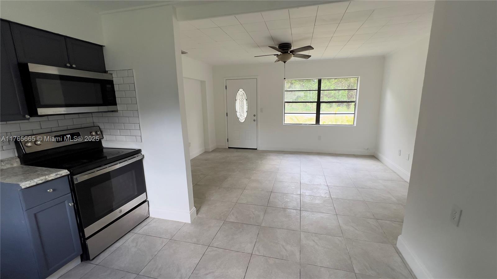 2008 North 47th Street Fort Pierce, FL 34947 - Photo 2 of 27 a kitchen with a stove and a microwave