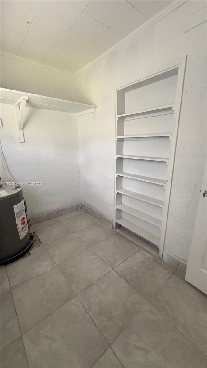 2008 North 47th Street Fort Pierce, FL 34947 - Photo 24 of 27 a view of walk in closet with empty racks