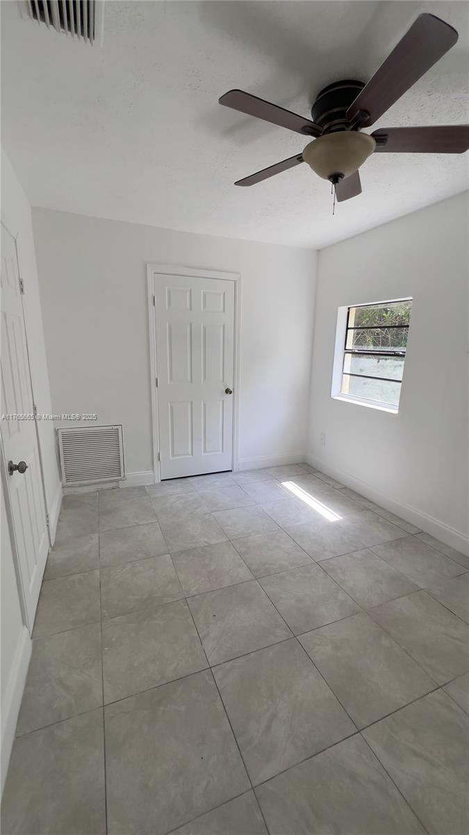 2008 North 47th Street Fort Pierce, FL 34947 - Photo 8 of 27 a view of an empty room with a window