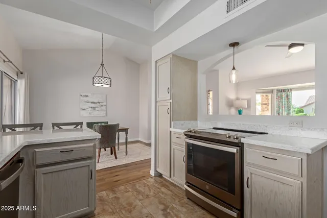 a kitchen with a stove oven and sink
