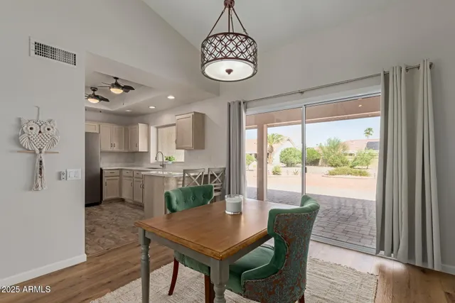 a view of a dining room with furniture window and wooden floor