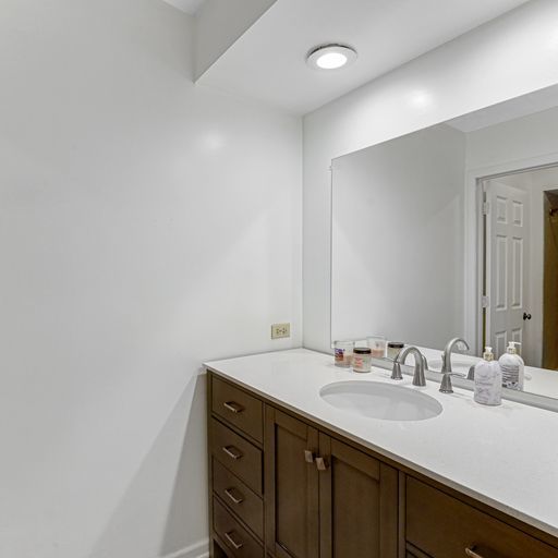 2930 Paris Road Olympia Fields, IL 60461 - Photo 15 of 27 a bathroom with a sink and a mirror