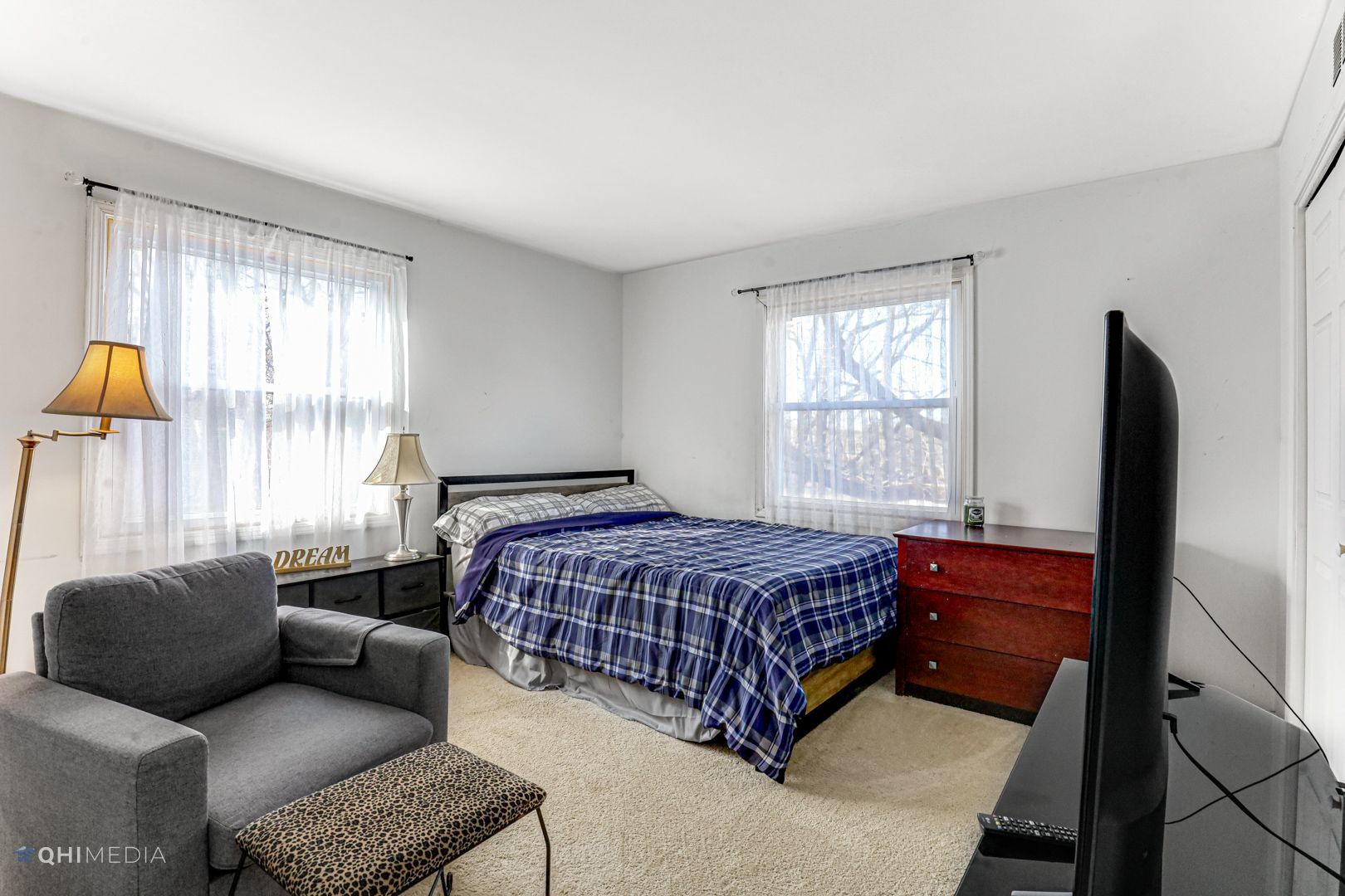 2930 Paris Road Olympia Fields, IL 60461 - Photo 19 of 27 a bedroom with a bed and a couch next to a window