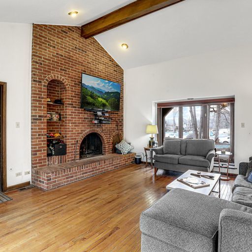 2930 Paris Road Olympia Fields, IL 60461 - Photo 2 of 27 a living room with furniture and a fireplace