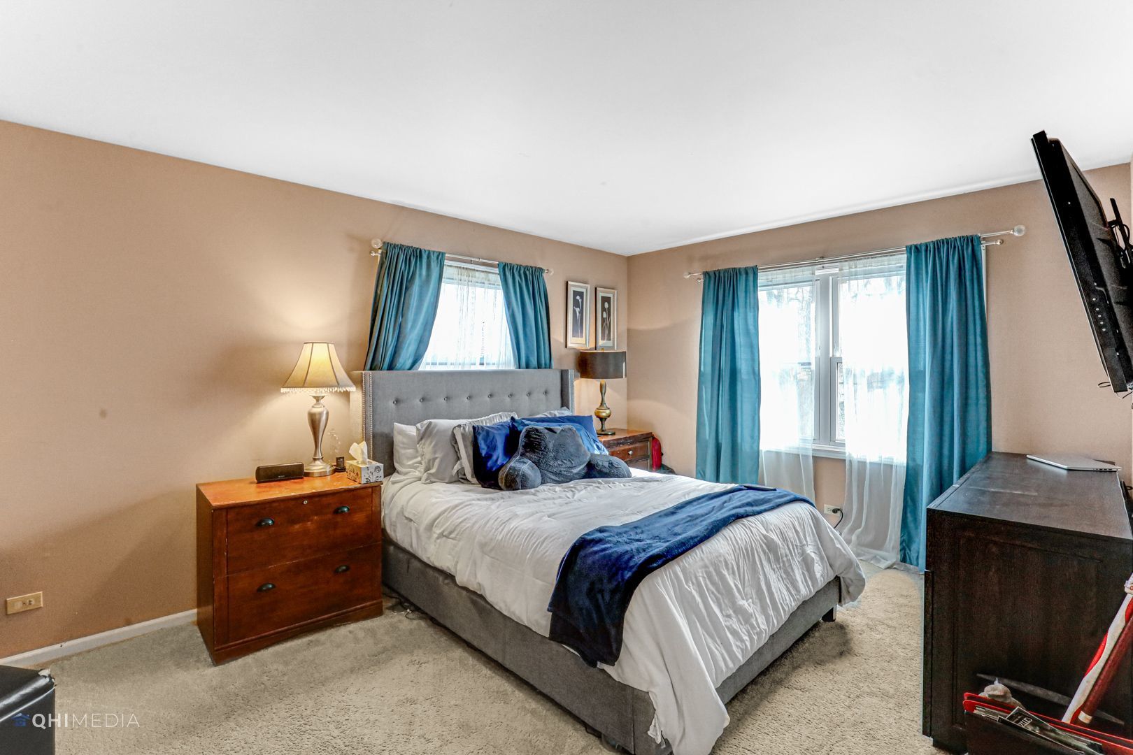2930 Paris Road Olympia Fields, IL 60461 - Photo 21 of 27 a bedroom with a bed and a flat tv screen on a dresser